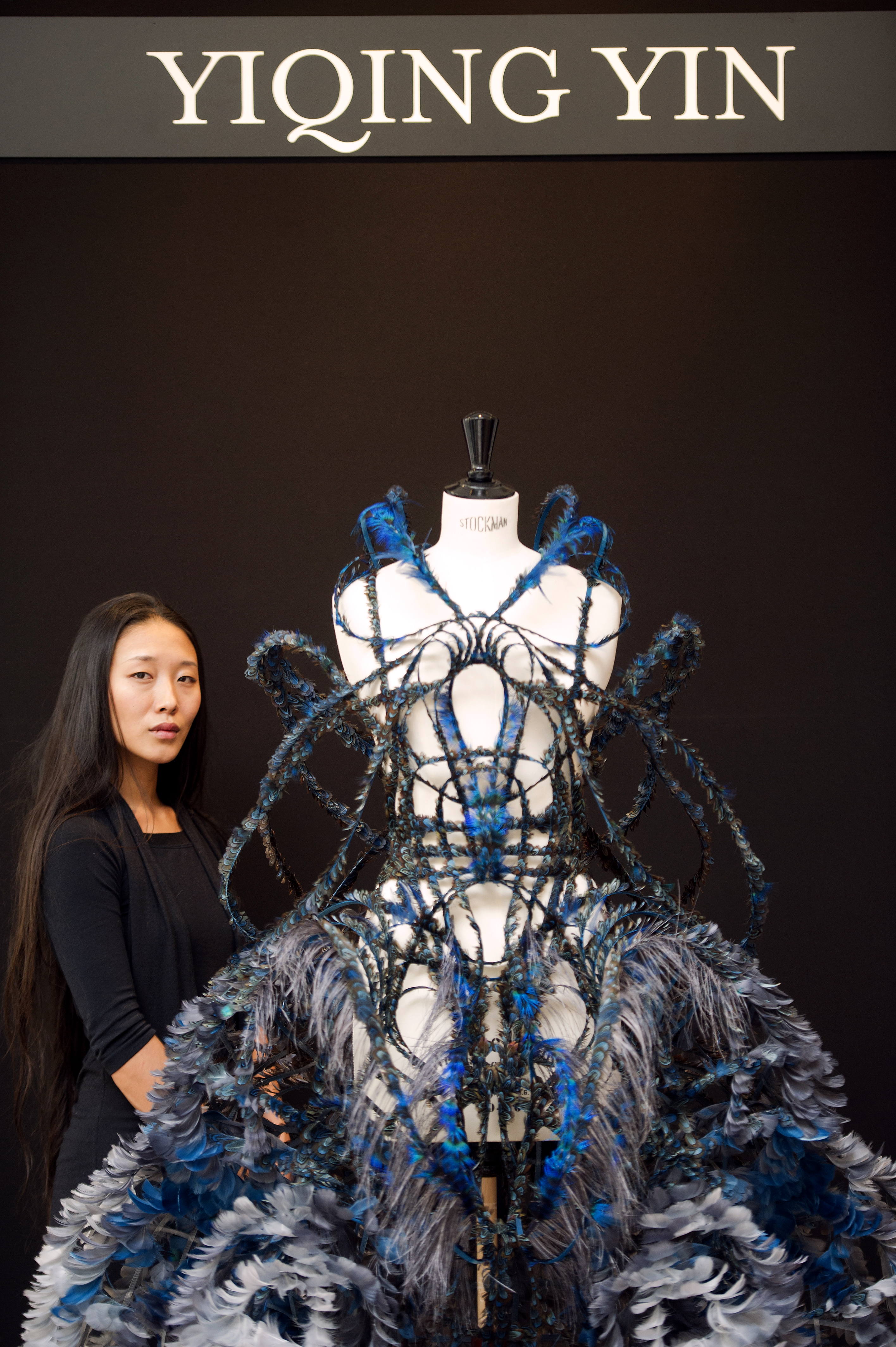 Yiqing Yin poses with one of her creations on September 26, 2012 in Paris. — AFP pic