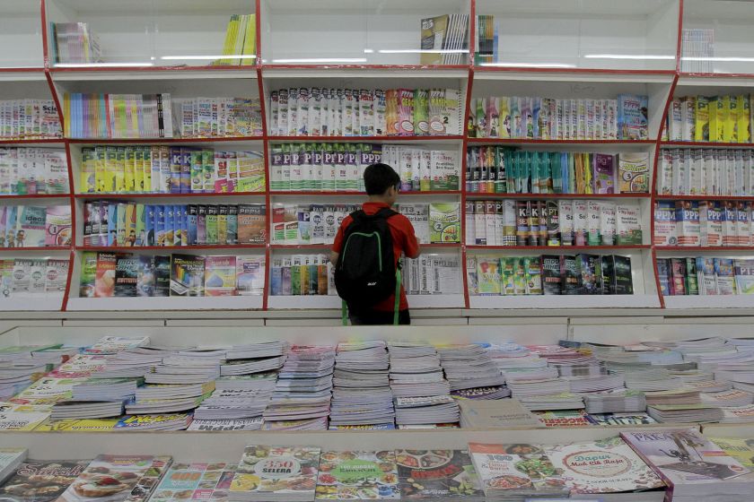 A young boy selects his school books in Kuala Lumpur to prepare for the new school term, December 26, 2015. u00e2u20acu201d Picture by Yusof Mat Isa