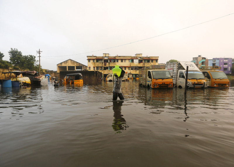 A man carries drinking water in a pitcher through a flooded street in Chennai, India, December 4, 2015. u00e2u20acu201d Reuters pic