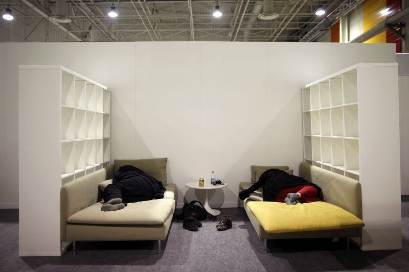 Participants working into the early hours rest in the Media Hall. 