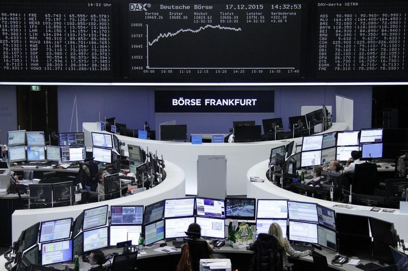 Traders work at their desks in front of the German share price index, DAX board, at the stock exchange in Frankfurt, Germany, December 17, 2015.u00c2u00a0u00e2u20acu201d Reuters pic