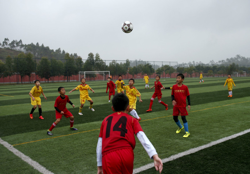 Students take part in a training match at Evergrande football academy in Qingyuan, southern China December 5, 2015. u00e2u20acu201d Reuters pic