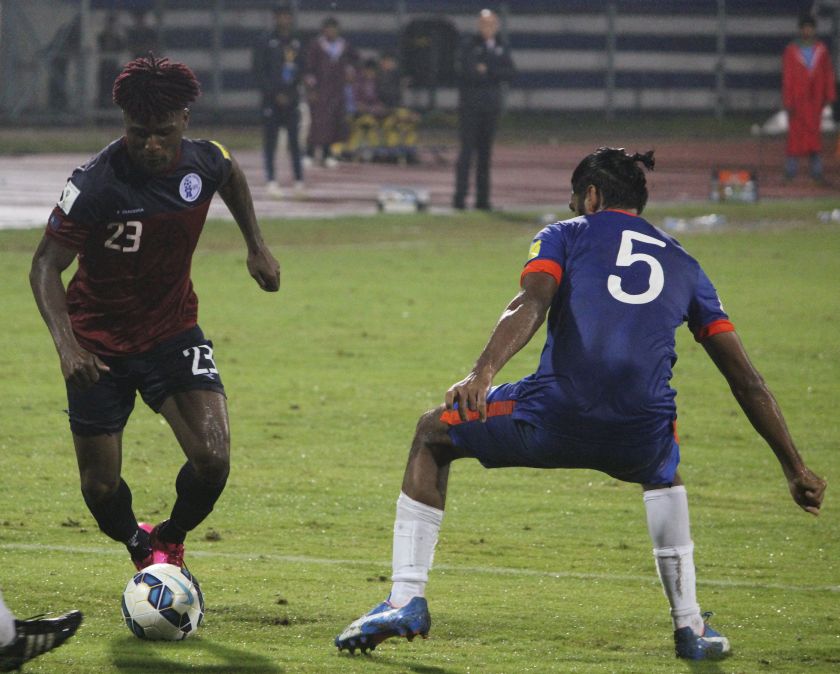 Guam forward Shane Andre Malcolm controls the ball against India's Gurwinder Singh during their World Cup qualifying soccer match in Bengaluru November 12, 2015. u00e2u20acu201d Reuters pic