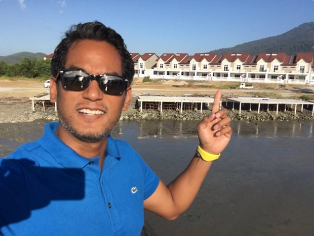 Khairy Jamaluddin points at the housing units in Langkawi which caused an uproar over the juxtaposition of the air wells and fire breaks that combined to resemble a cross. u00e2u20acu2022 Twitter screengrab