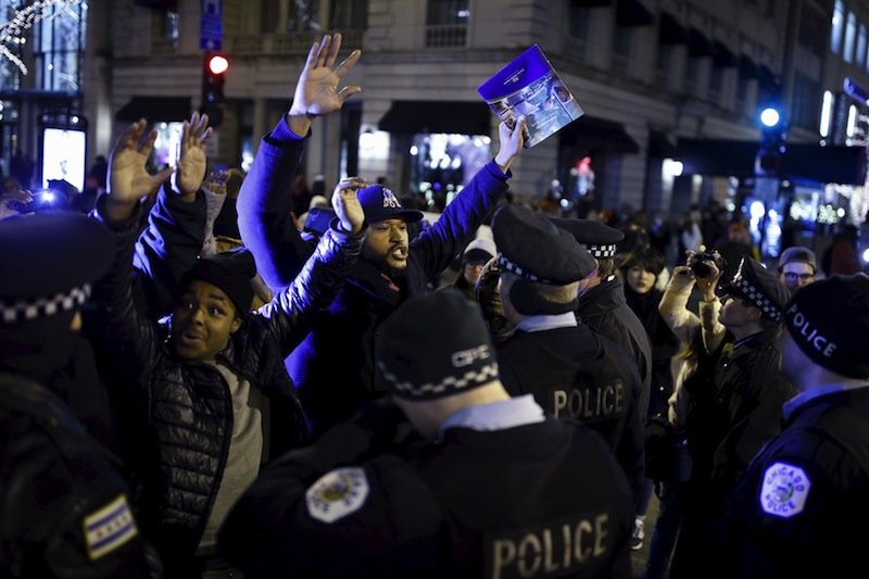 Demonstrators confront police officers during a protest in reaction to the fatal shooting of Laquan McDonald in Chicago, Illinois, November 27, 2015. u00e2u20acu201d Reuters pic