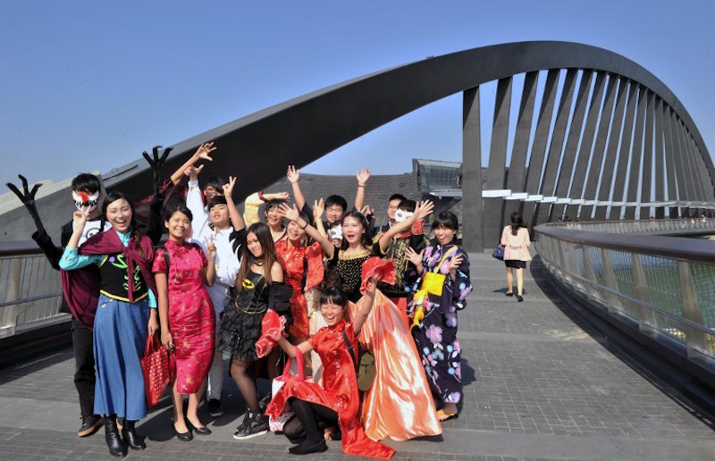 Local art groups pose for photos on opening day in front of the new National Palace Museum branch in the southern Taiwan city of Chiayi December 28, 2015. — AFP pic