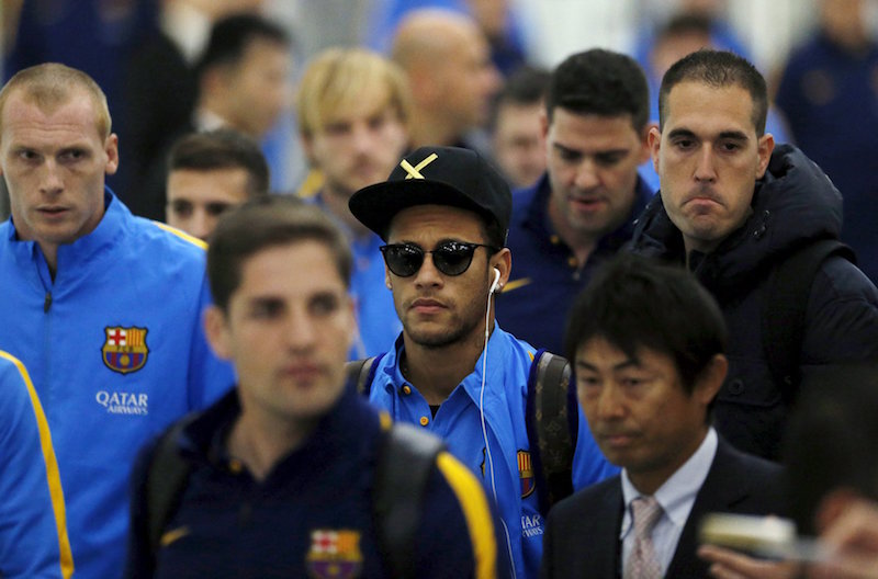 Barcelona player Neymar and his team mates walk upon their teamu00e2u20acu2122s arrival at Narita International airport near Tokyo December 14, 2015. u00e2u20acu201d Reuters pic