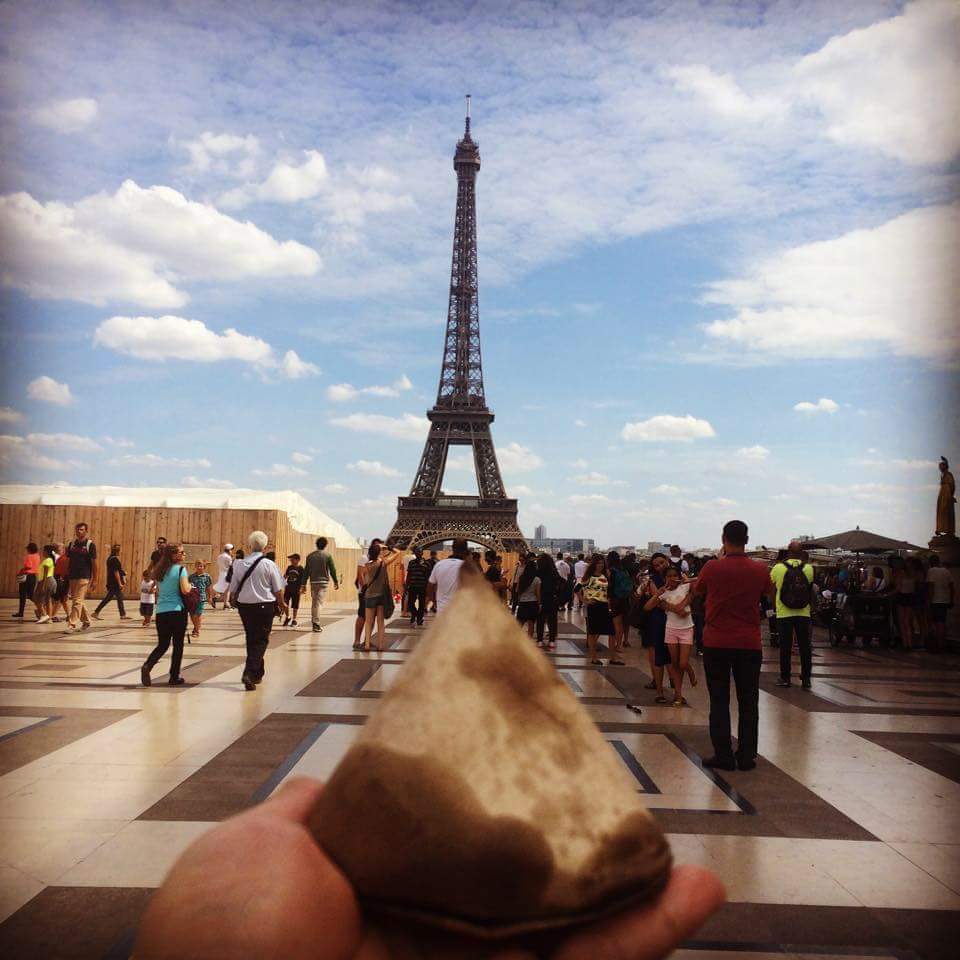 A packet of nasi lemak in front of the Eiffel Tower.