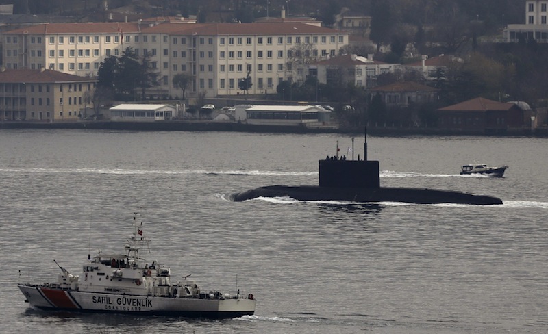 Russia's submarine Rostov-on-Don is escorted by a Turkish Navy Coast Guard boat as it sets sail in the Bosphorus, in Istanbul, Turkey, December 13, 2015. u00e2u20acu201d Reuters pic