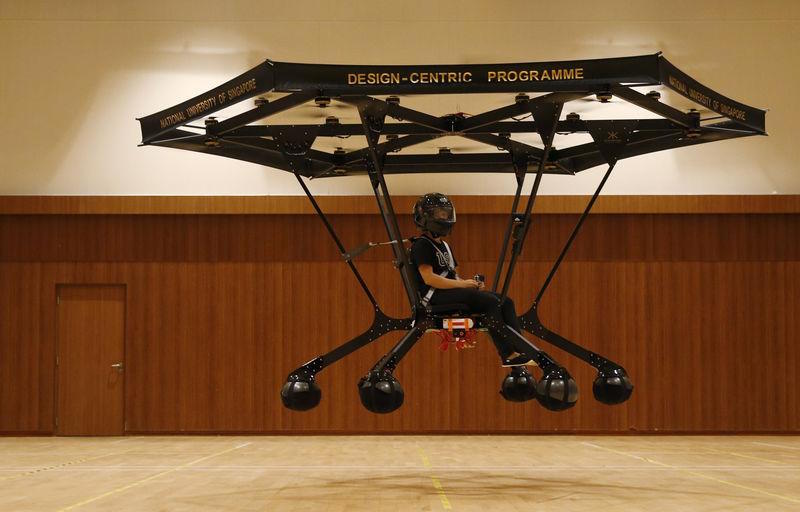 Student Zheng Xiaowen sits in the Snowstorm, a personal flying machine built by a group of engineering students of the National University of Singapore (NUS), as it flies in NUS gymnasium in Singapore December 10, 2015. u00e2u20acu201d Reuters pic