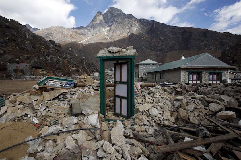 A door of a collapsed house stands after the earthquake damaged it earlier this year at Khumjung, a typical Sherpa village in Solukhumbu district also known as the Everest region, in this picture taken November 30, 2015. — Reuters pic