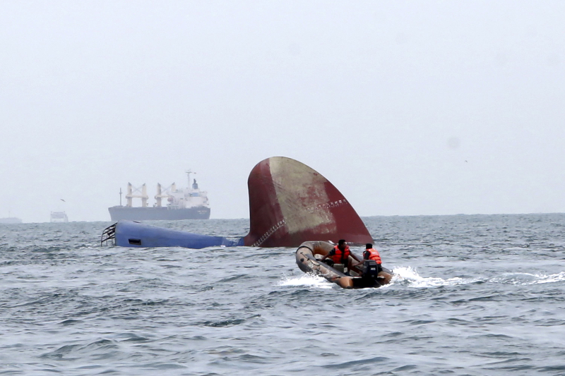An Indonesia rescue team approaches the sunken freighter MV Thorco Cloud which sank after colliding with a tanker the night before in the Singapore Strait off Batam December 17, 2015 in this photo taken by Antara Foto. u00e2u20acu201d Reuters pic