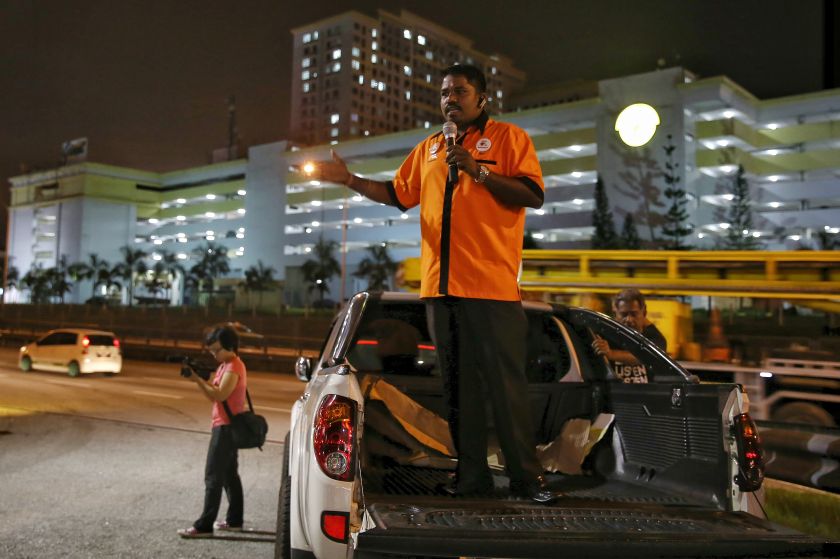 A protester delivers a speech from the back of a pick-up truck during the #ShutdownSungaiBesi rally near the Sungai Besi toll plaza, Kuala Lumpur, on January 1, 2016. u00e2u20acu201d  Picture by Saw Siow Feng