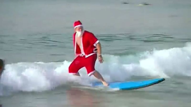 In Sydney, Australia, 320 Santas set Guinness World Record for largest surf lesson. u00e2u20acu2022 Reuters pic