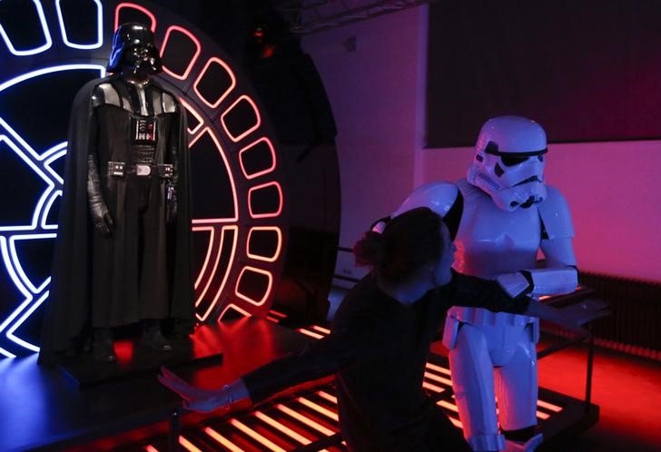 A visitor poses with a character from the Star Wars film series during a press preview for the exhibit 'Star Wars Identities' at the MAK museum in Vienna, Austria, December 17, 2015. u00e2u20acu201d Reuters pic