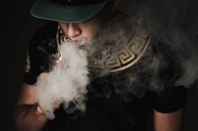 Portrait of a man vaping with his face partially covered by vapour. u00e2u20acu2022 Picture by Yusof Mat Isa
