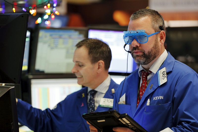 A trader wears plastic glasses to celebrate the last trading day of 2015 while working on the floor of the New York Stock Exchange shortly after the opening bell in New York December 31, 2015. u00e2u20acu201d Reuters pic