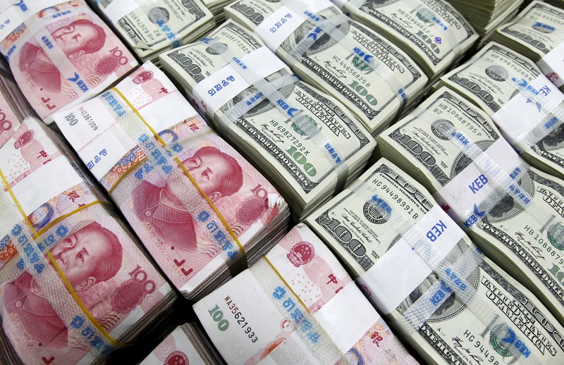 US dollar and Yuan notes are seen in this picture illustration taken at the Korea Exchange Bank in Seoul in this November 10, 2010 file photo. u00e2u20acu201d Reuters pic