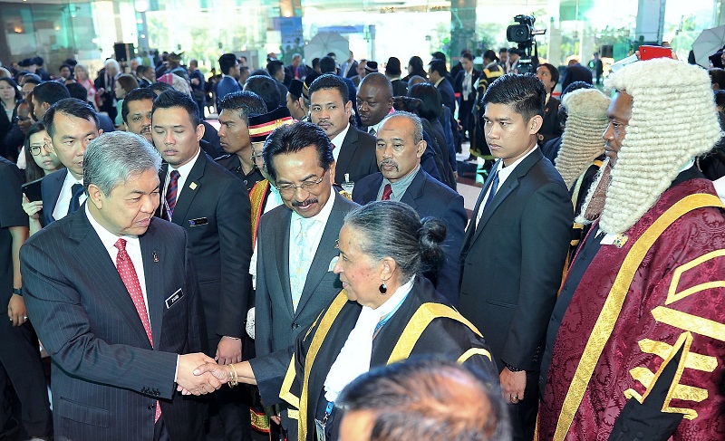 Deputy Prime Minister Datuk Seri Dr Ahmad Zahid Hamidi (left) and Sabah Chief Minister Datuk Seri Musa Aman greet delegates at the 23rd Conference of Speakers and Presiding Officers of the Commonwealth (CSPOC) in Kota Kinabalu, January 11, 2016. u00e2u20acu201d Berna