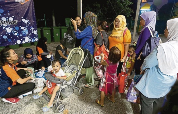 Baby diapers handed out to needy mothers at a temporary food distribution centre in Lorong Medan Tuanku 2, Kuala Lumpur. u00e2u20acu201d Malay Mail pic