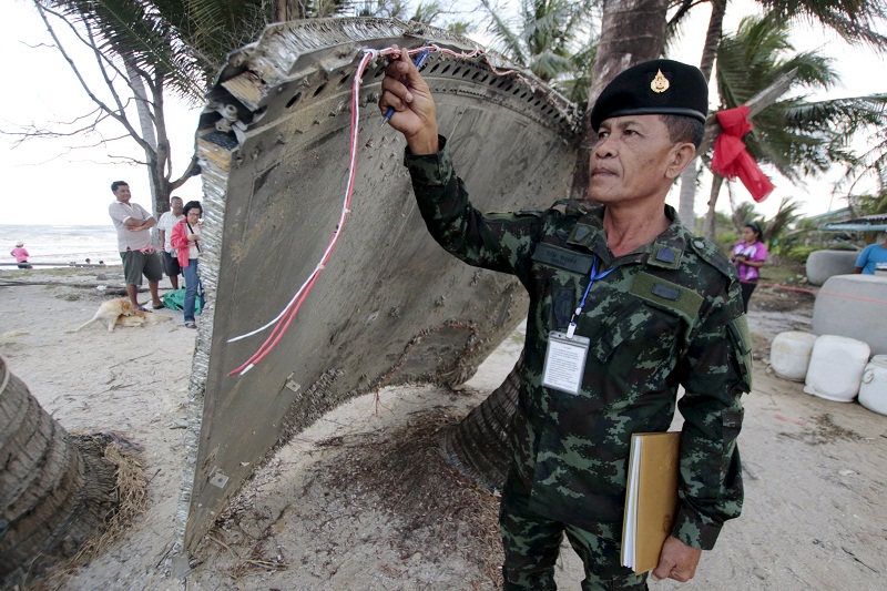 Thai army soldier inspects a piece of suspected plane wreckage which has been found off the coast of southern Thailand in Nakhon Si Thammarat province, January 24, 2016. u00e2u20acu201d Reuters pic