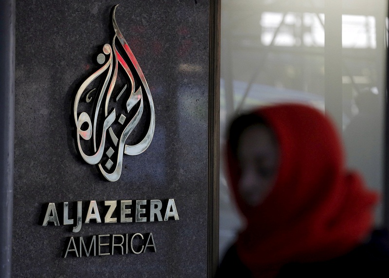 A woman passes by the Al Jazeera America broadcast centre in midtown Manhattan in New York City, in this January 13, 2016 file photo. u00e2u20acu201d Reuters pic