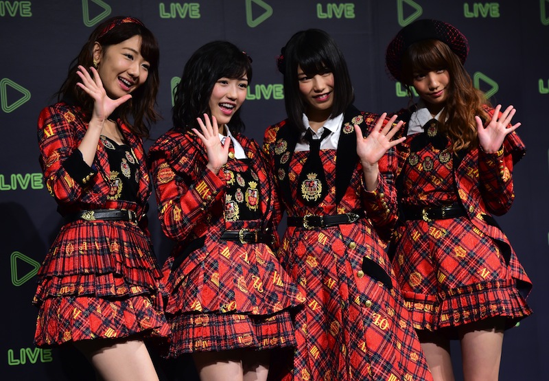 Japan's girl pop group AKB48 members (from left) Yuki Kashiwagi, Mayu Watanabe, Yui Yokoyama and Rena Kato pose for photographs in Tokyo on December 10, 2015. u00e2u20acu201d AFP pic