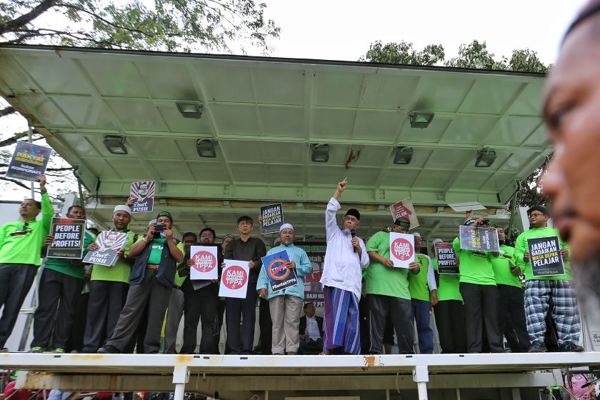 PKR vice-president Chua Tian Chang (third from left) and other PKR and Parti Amanah leaders attend the anti-TPP Rally at Padang Merbok in Kuala Lumpur, January 23, 2016. u00e2u20acu201d Picture by Saw Siow Feng