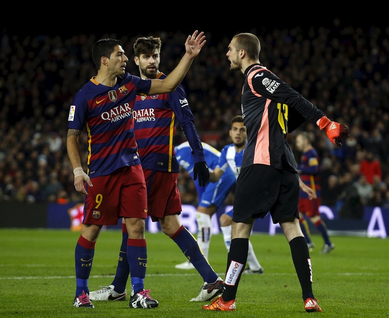 Barcelona's Luis Suarez (left) and Gerard Pique argue with Espanyol's goalkeeper Pau Lopez during the Barcelona v Espanyol Spain King's Cup match at Camp Nou stadium. u00e2u20acu201d Reuters pic