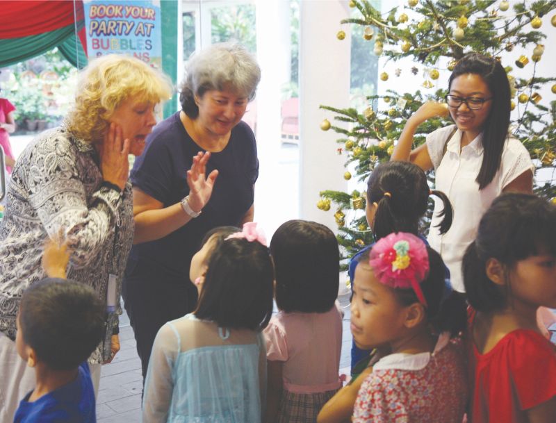 Victoria Marguerite Treadell says hello to guests at a Christmas party for children recently. u00e2u20acu2022 Picture courtesy of the British High Commission