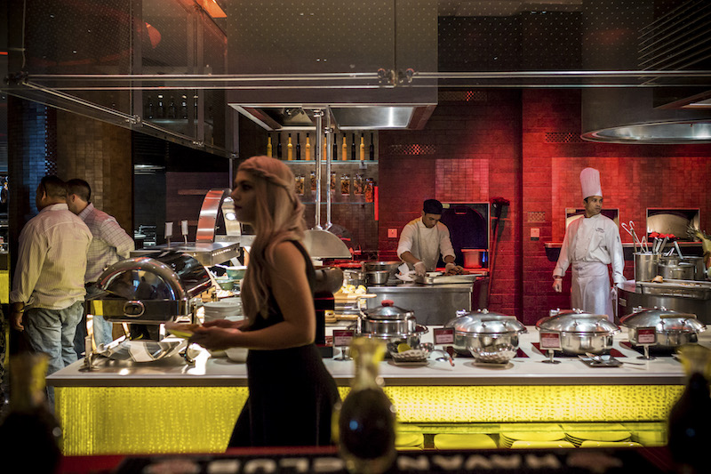 Saffron’s brunch buffet has more than 220 dishes to choose from, but this 21-and-up brunch is really all about inventive day drinking and a posterior-shaking soundtrack. — Picture by Christophe Viseux/The New York Times