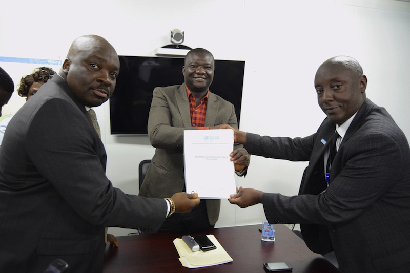 (From left) Desmond Williams, Tolbert Nyenswah and Dr Alex Gasasira hold up a certificate announcing an end to the latest flare-up of the Ebola virus, in Monrovia, Liberia, January 14, 2016. u00e2u20acu201d Reuters pic