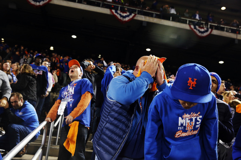 New York Mets fans react as their team blows a lead in the ninth inning of Game 5 of the World Series, at Citi Field in New York November 1, 2015. u00e2u20acu201d Picture by Todd Heisler/The New York Times
