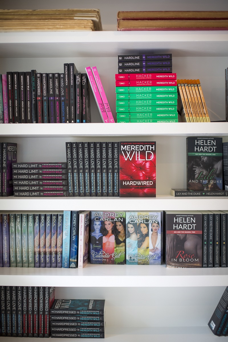 Some of Meredith Wild’s self-published titles, shelved with other authors of her Waterhouse Press imprint, at her home in Destin, Florida, January 21, 2016. — Picture by Meggan Haller/The New York Times