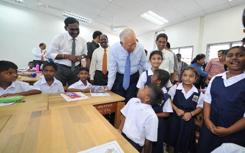 Prime Minister Datuk Seri Najib Razak (centre) interacting with the students of Sekolah Jenis Kebangsaan Tamil (SJKT) Dengkil when he visits the school on Jan 6, 2016 in Dengkil, Selangor. u00e2u20acu201d Bernama pic
