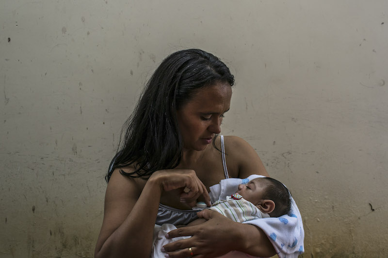 Roziline Ferreira de Mesquita holds her three-month-old son, Arthur, who has microcephaly, as they wait to see a doctor at the Oswaldo Cruz Hospital in Recife, Brazil, January 29, 2016. u00e2u20acu201d Picture by Mauricio Lima/The New York Times