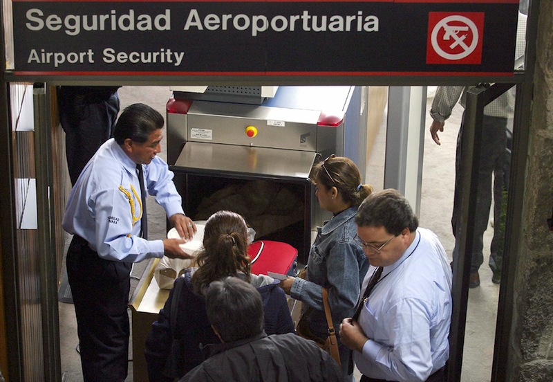 Passengers of an internal Mexican flight to Tijuana, near the border with the United States, have their luggage inspected by security personnel prior to boarding 06 January, 2003 at Toluca's airport, Mexico. u00e2u20acu201d AFP pic