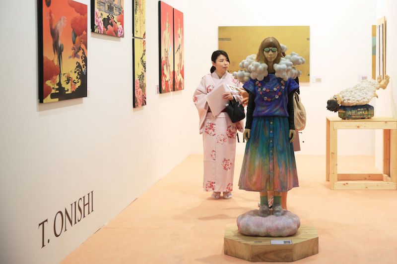 Kunihiko Nohara’s sculpture ‘Spring (2015)’ stands beside paintings by Takashi Onishi at Art Stage Singapore 2016. — TODAY pic