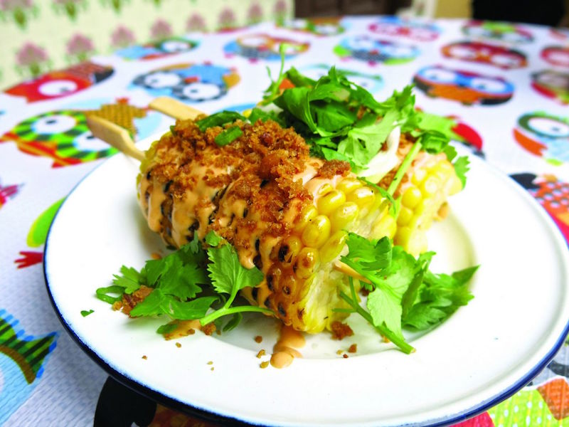 Howu00e2u20acu2122s this for tasty: Ears of barbequed corn slicked with a glaze of Sriracha sauce mixed with Japanese mayo and shrimp crumbs. u00e2u20acu201d TODAY pic