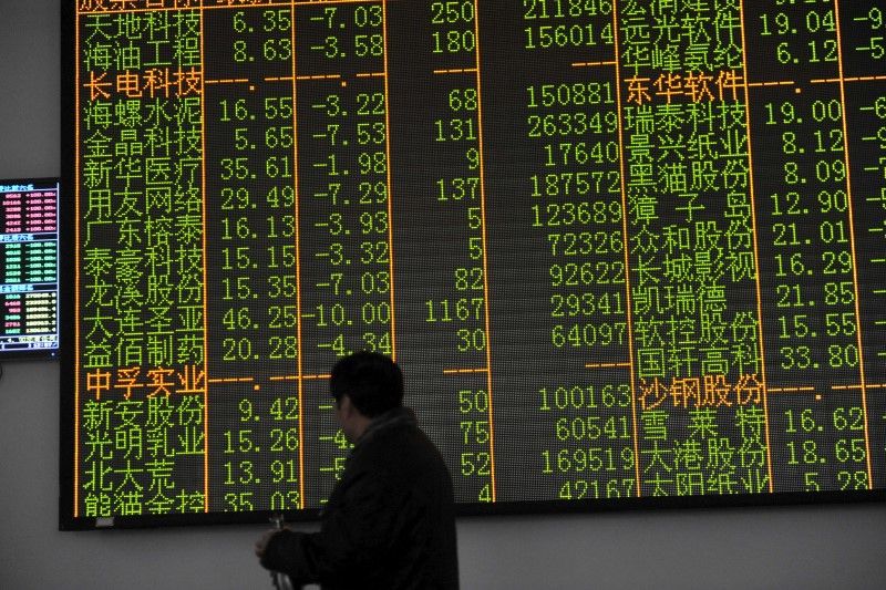 An investor looks at an electronic screen showing stock information at a brokerage house in Hangzhou, Zhejiang province, January 7, 2016. u00e2u20acu201d Reuters pic 