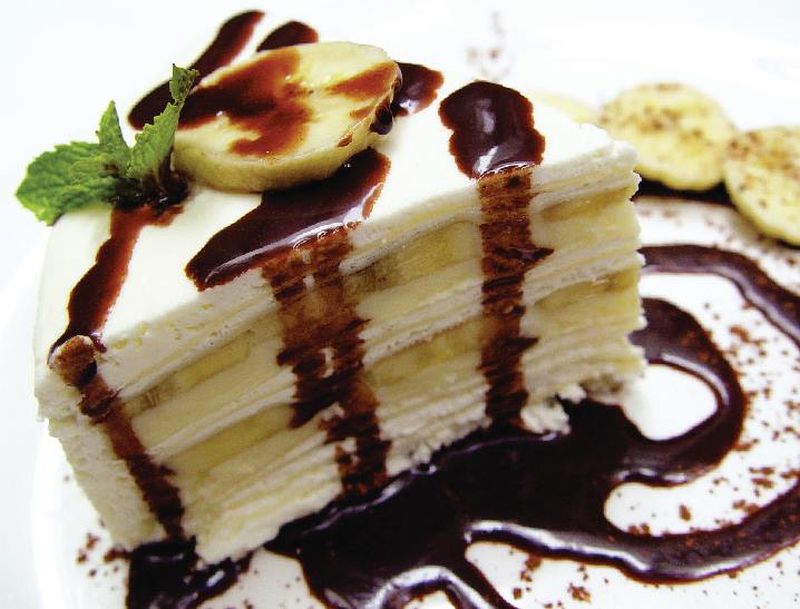 Resistance is futile with their Chocolate Banana Crepe Cake with decadent chocolate sauce. u00e2u20acu2022 Picture courtesy of Greyhound Cafe Malaysiau00e2u20acu2122s Facebook page