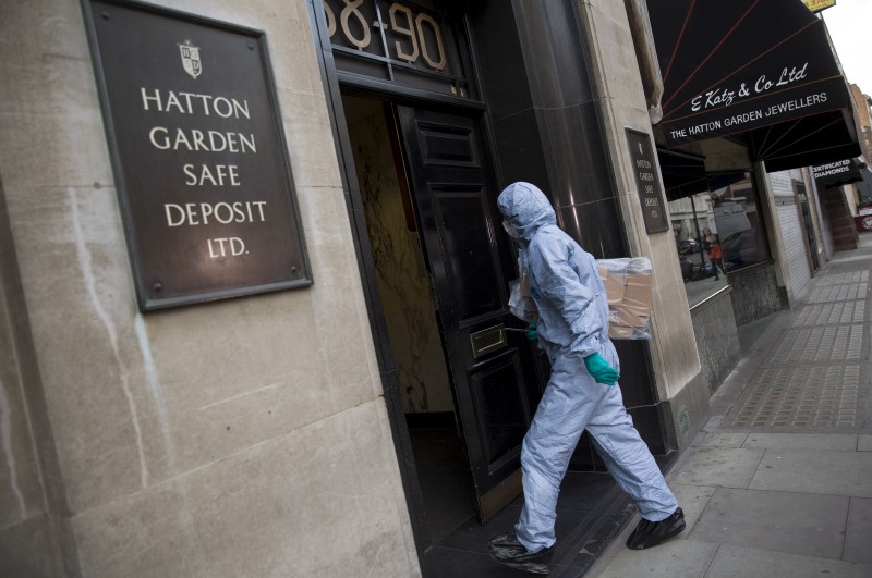 A police forensic officer enters a safe deposit building on Hatton Garden in central London April 7, 2015. u00e2u20acu201d Reuters pic