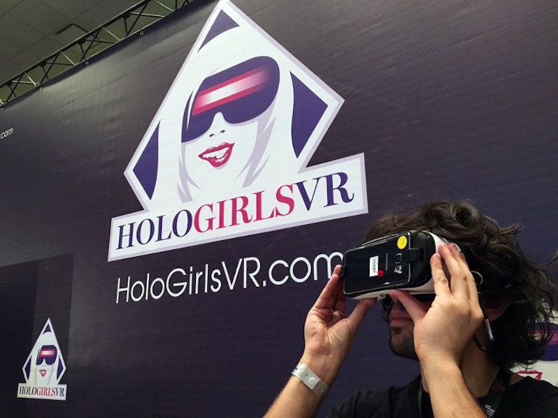Kendrick Thomas, world operations manager for HoloFilm Productions, demonstrates on January 20, 2016, in Las Vegas, how a porn consumer could use available Samsung goggles with new virtual reality hardware to produce a new pornography viewing experience. 