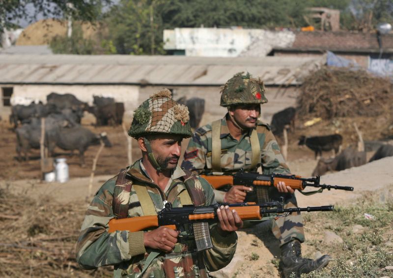 Indian army soldiers stand guard near the Indian Air Force (IAF) base at Pathankot in Punjab, India, January 3, 2016. Troops worked to clear the compound near Indiau00e2u20acu2122s border with Pakistan after a 15-hour gunbattle. REUTERS/Mukesh Gupta