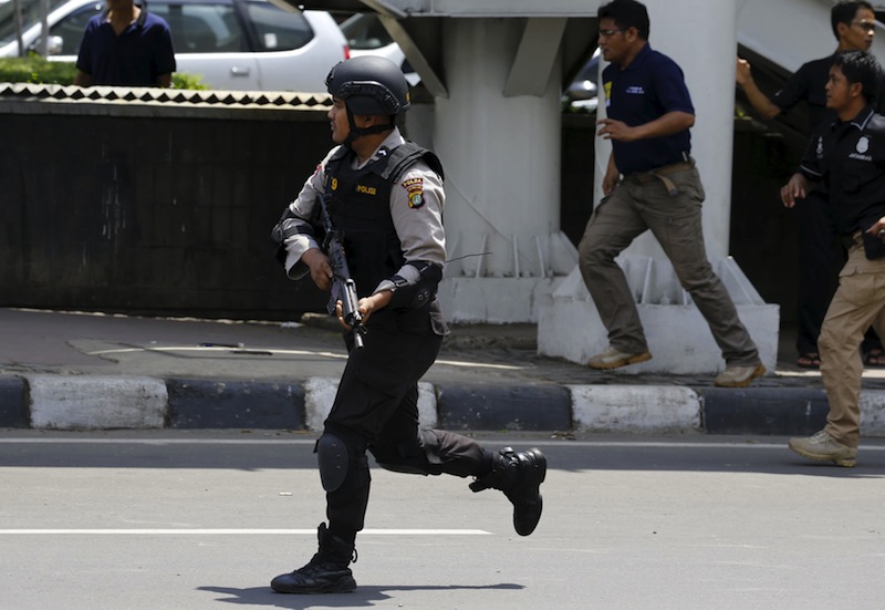 An Indonesian policeman runs near the site of a blast in Jakarta, Indonesia, January 14, 2016. u00e2u20acu201d Reuters pic