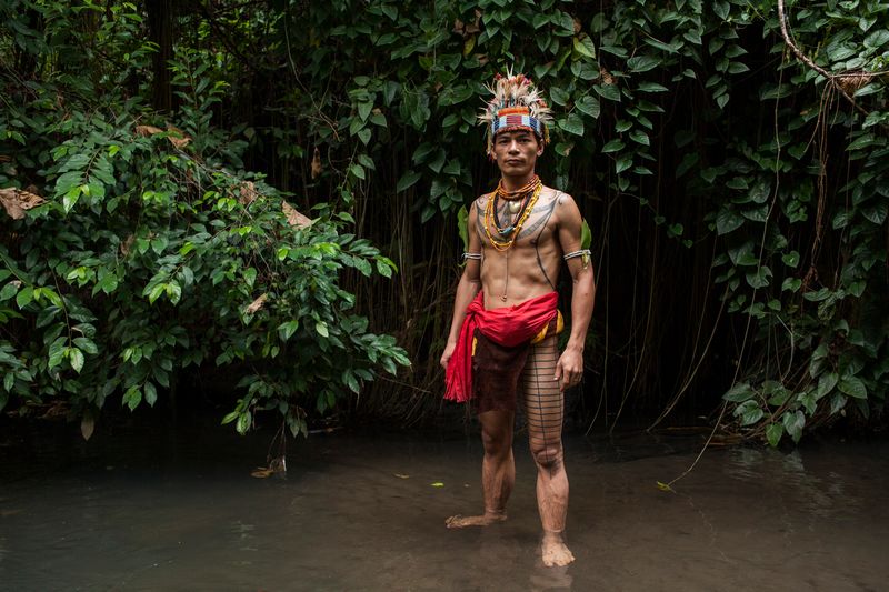 Esmat Sakulok, poses to display his body tattoo design from the Mentawai tribe origin during the traditional tattoo festival in Yogyakarta, December 6, 2015. u00e2u20acu201d AFP pic