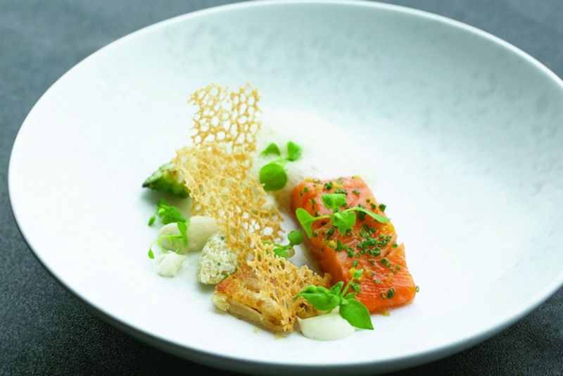 Jaan continues to excite diners with deceptively bold ideas such as this dish of confit rainbow trout with organic chicken wing. — TODAY pic