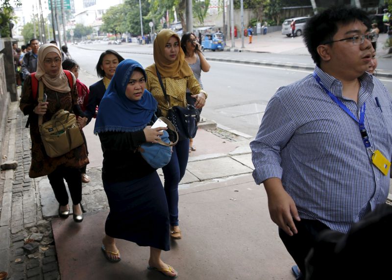 Indonesian workers run as they are evacuated from their office at Thamrin business district in Jakarta January 14, 2016. u00e2u20acu2022 Reuters pic 
