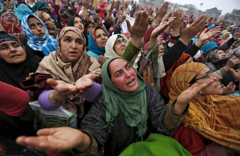 Kashmiri Muslims women react upon seeing a relic believed to be hair from the beard of Prophet Mohammed, being displayed on the Friday following the festival of Eid-e-Milad-ul-Nabi at Hazratbal shrine in Srinagar, India, January 1, 2016. u00e2u20acu201d Reuters pic