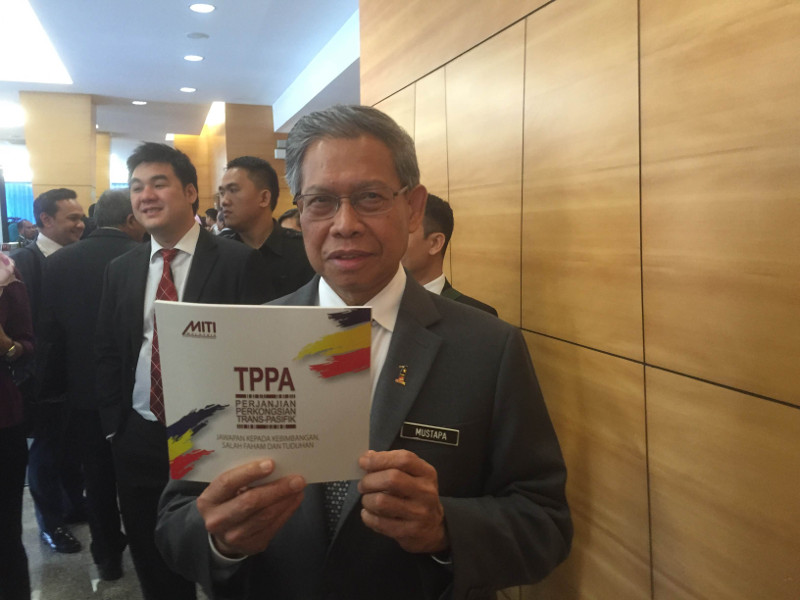 International Trade and Industry Minister Datuk Seri Mustapa Mohamed with a copy of the Trans-Pacific Partnership (TPP) agreement at the Dewan Rakyat in Kuala Lumpur January 26, 2016. u00e2u20acu201d Picture by Kamles Kumar